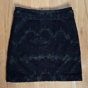 Elegant Black Lace Skirt over dark green fabric. Size 2